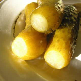 Pickled gherkins showing how the flower and stalk ends have been removed.
