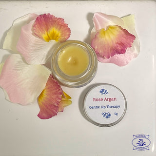 rose argan lip balm on white ceramic