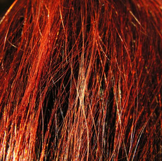 This is my hair with bright sunlight shining on it. My natural hair colour is brown and grey. So this 'henna red.'