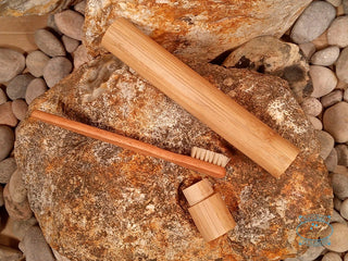 a wooden toothbrush holder with a bristle toothbrush