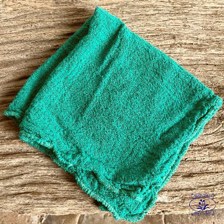teal lint free co cleaning cloth on oak bench