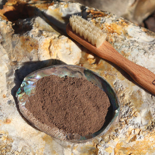 walnuts bark powder with a tradition boar bristle toothbrush