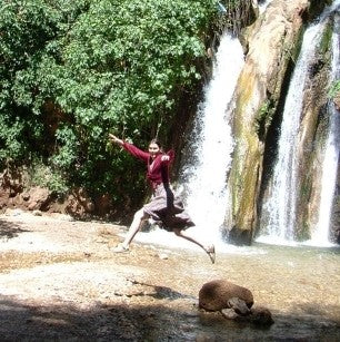 Sally leaping at waterfall