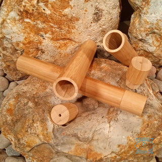 wooden toothbrush holders by natural spa supplies on a rock