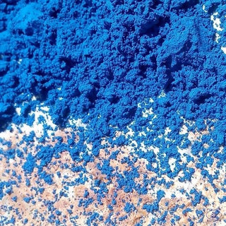 Blue Indigo Power of cosmetic use scattered on a rock