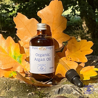 argan oil with pipette and oak leaves